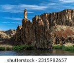 Owyhee River rock formations with blue sky above