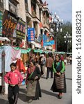 Small photo of Lhasa. Tibet. China. 10.03.06. The Barkor in the city of Lhasa is a circuit of streets that surround the Jokhang Buddhist Temple. Pilgrims perambulate clockwise around the circuit to reach the temple.