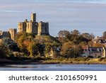 Small photo of Warkworth Castle - a ruined medieval castle in the village of Warkworth in the county of Northumberland, northeast England. The village and castle occupy a loop of the River Coquet.