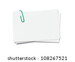 Stack of business cards with paper clip isolated on white background with clipping path