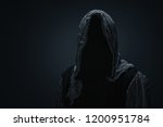 Silhouette of a death over dark gray background with copy space 