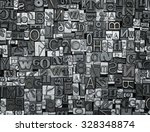 Letterpress background, close up of many old, random metal letters with copy space
