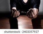 Small photo of Handcuffed Male Hands in Restraint