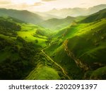 View of the green mountains and hills at sunset. Beautiful summer landscape. Aktoprak Pass in North Caucasus, Russia. 