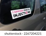 Small photo of TAIPA, NZL - JAN 18 2023:I oppose forced injections sticker on a car window.Anti-vax sentiment is becoming more entrenched among nearly a third of New Zealanders.