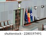 Small photo of CANBERRA, ACT - MAR 16 2023:Australian flags at The House of Representatives inside Australia Parliament House.It is made up of 151 members. Each member represents one of Australia's 151 electorates.