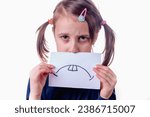Small photo of Fake sadness, manipulation, fake facial expression, fake emotion and psychological trouble. Beautiful young girl holding banner with fake sad face expression.