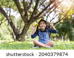 asian little child girl with... | Shutterstock . vector #2040379874