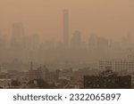 Small photo of Thick haze over the Manhattan skyline caused by wildfire smoke