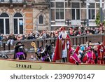 Small photo of AMSTERDAM, The NETHERLANDS - NOVEMBER 19, 2023: Every year Sinterklaas (Dutch Santa Claus) and his Piten arrives in Amsterdam by boat from Spain, bringing great joy to children.