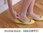 Small photo of Woman's heels with blister plaster on close up. Prevent New Shoes From Giving Blisters.