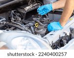 Ignition coil and car spark plug change or replacement. Repairing of vehicle engine.
