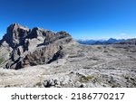 Small photo of incredible breathtaking mountain landscape in the Dolomites on Mount Rosetta which looks like the lunar surface and an alpine hut in the middle