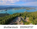 Landscape view of the Alpine lake, Woerthersee, and its parking lots in the southern Austrian state of Carinthia. Photo taken from the Pyramidenkogel Tower