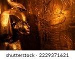 Small photo of Egyptian Golden Goddess who shelters a box containing human organs, tomb of Pharaoh Tutankhamun. close up