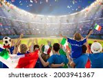 Small photo of Italy football supporter on stadium. Italian fans on soccer pitch watching team play. Group of supporters with flag and national jersey cheering for Italia. Championship game. Forza Azzurri