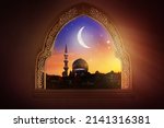 Small photo of Ramadan Kareem greeting. Islamic city with mosque skyline, crescent moon and stars. View from a window. End of fasting. Hari Raya card. Eid al-Fitr. Breaking of holy fast day. Muslim holiday.