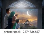 Ramadan Kareem greeting. Family at window looking at Islamic city with mosque skyline, crescent moon and stars. Muslim parents and children pray. Mother, father and kids celebrate end of fasting. 
