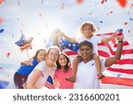 Small photo of American family celebrating 4th of July. People watching Independence Day fireworks holding US flag. Proud USA crowd cheer and celebrate. Group with America symbol. National holiday party.