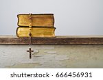 The book of Catholic Church liturgy and rosary beads on the wooden table
