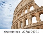 Background made of Colosseum with blue sky and clouds. Rome. Italy. Horizontally. 