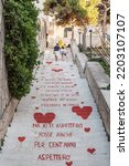 Small photo of Vieste, the stairway of love, decorated with red hearts and the lyrics of a popular song. Vieste, Gargano, Puglia, Italy, July 2020