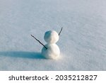 Small photo of snowmen made of snow in winter, small snowmen stand on the snow in winter