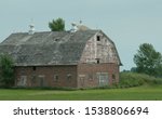 Small photo of Old brick barn with gambrel roof