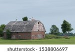 Small photo of Old brick barn with gambrel roof