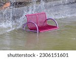 A Park Bench Is Flooded By High ...