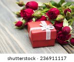 Red Roses  And Gift Box On A...