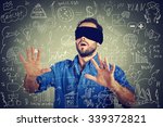 Blindfolded young business man searching walking through complicated social media financial data plan. Sightless entrepreneur analyst managing corporate unknown  financial economy risk concept 