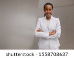Small photo of Smiling cheerful headshot portrait of an african businesswoman, corporate executive, business career professional in swanky stylish suit