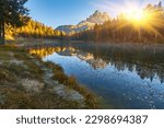 landscape of Antorno lake with famous Dolomites mountain peak of Tre Cime di Lavaredo, Italy Europe.