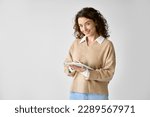 Small photo of Young smiling professional business woman or student holding digital tablet, using tab computer standing isolated at white background advertising online education on smart technology device.