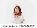Small photo of a lilt woman with a birthday cake with candles. traditional sweet treat and wish-making for a birthday.