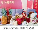 Small photo of Russia, Rostov-on-Don, 22.04.2023. The decor of the festive table for the traditional Korean celebration of the sixtieth anniversary of the parents.