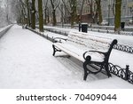 Snow On Bench In Park Of Winter.