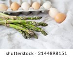 asparagus and eggs on a fabric... | Shutterstock . vector #2144898151