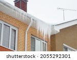 Big Icicles On The Roof Of A...