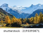 Scenic view at snow capped mountains in autumn