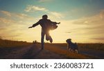 Teen girl running with dog in...