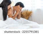 Small photo of Wife and husband heal reconcile from sulk by caressing and hugging together. Caring man make peace and reconcile with lover. Couple in Sulk problems together in white bed.