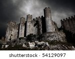 Disturbing scene with medieval castle at night with stormy sky