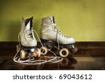 Old worn roller skates with big ...