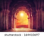 Old ruined arch in ancient temple at sunset in India