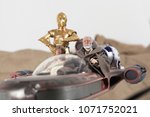 Small photo of APR 17 2018: Recreation of a scene from Star Wars A New Hope; Luke Skywalker, Obi Wan 'Ben' Kenobi and the droids R2D2 and C3P0 riding in a X34 Landspeeder on Tattooine - Hasbro Black Series figures