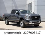 Small photo of Fishers - Circa May 2023: Nissan Titan display at a dealership. Nissan offers the Titan in King Cab and Crew cab models.