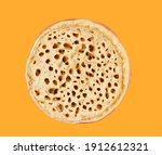 Small photo of Crumpet isolated on the yellow
