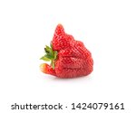 Ugly organic home grown strawberry isolated on white background.Trendy ugly food.Strange funny imperfect fruit .Misshapen produce, food waste concept. Top view, copy space.